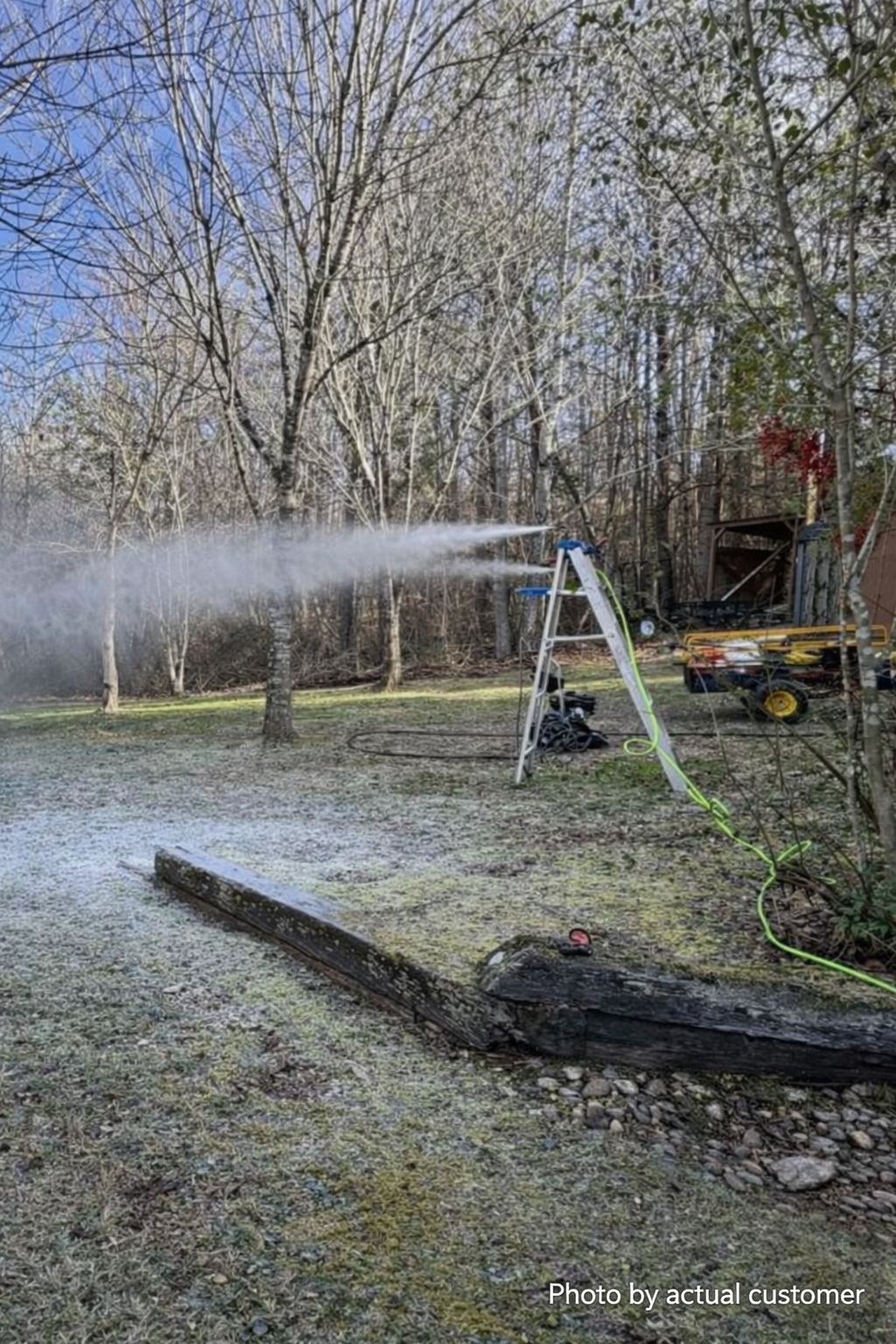 Snow gun mounted on a ladder spraying a wide snow plume